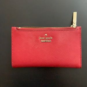 Red Kate Spade bi fold wallet